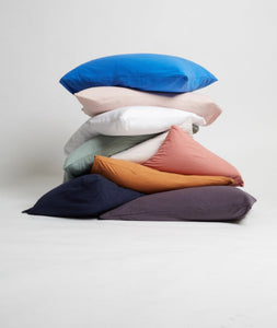 It-fits jersey pillow slips in Royal blue, pink, white, sage green, beige, rose, ginger brown, navy blue and charcoal grey  ascetically stacked