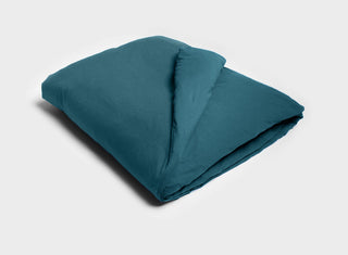 It-Fits quilt cover in petrol green, showcasing a smooth, soft texture, made from certified Australian cotton jersey.