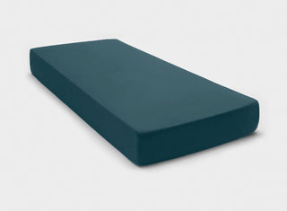 Luxurious 100% Australian Cotton fitted sheet by It-Fits in petrol green colour, fitted on a mattress with deep pockets on a plain background.