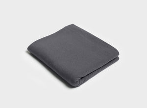 Folded flat sheet in charcoal grey by It-Fits, made from smooth, breathable 100% Australian cotton jersey, perfect for summer.