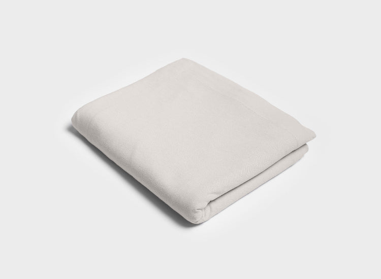 Luxurious 100% Australian Cotton jerset flat sheet by It-Fits in beige folded, featuring wide top edge and soft, breathable cotton jersey fabric.