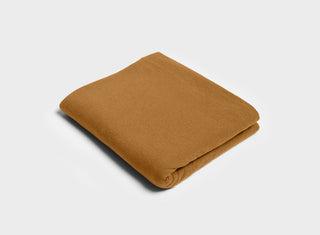 Folded flat sheet in ginger brown by It-Fits, made from 100% Australian cotton jersey, designed for a comfortable summer sleep.