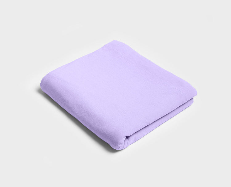 Lavender purple flat sheet by It-Fits, folded neatly, made from 100% Australian cotton jersey, perfect for warm, comfortable nights.