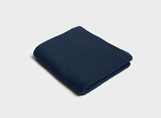 Navy blue folded flat sheet by It-Fits, made from 100% Australian cotton jersey, designed for comfortable summer nights.