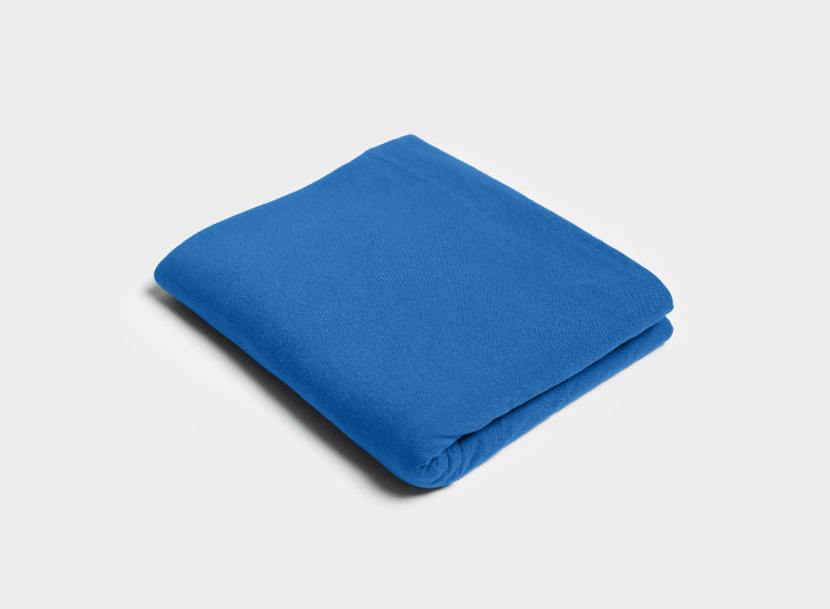 Jersey flat sheet by It-Fits in royal blue, folded on a white background, made from smooth, breathable 100% Australian cotton jersey