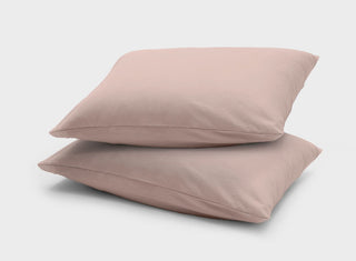 It-Fits cooling jersey pillow slips, 2 pack on stacked pillows, made from smooth, soft cotton for a calming and restful sleep with temperature control.