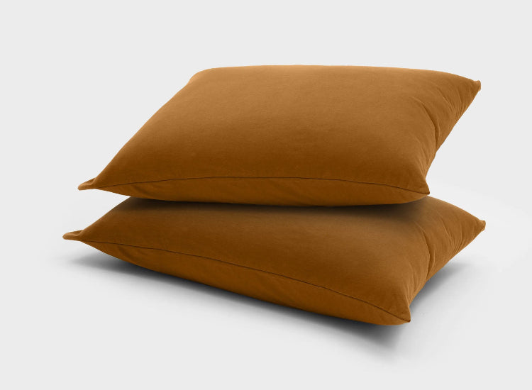 Ginger brown pillow slips by It-Fits, 2 pack crafted from soft 100% Australian cotton jersey, indicating warmth and softness for a cozy night’s sleep.